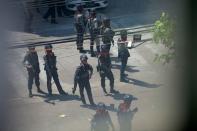 Police stand after they seized Sanchaung district in search of anti-coup demonstrators in Yangon