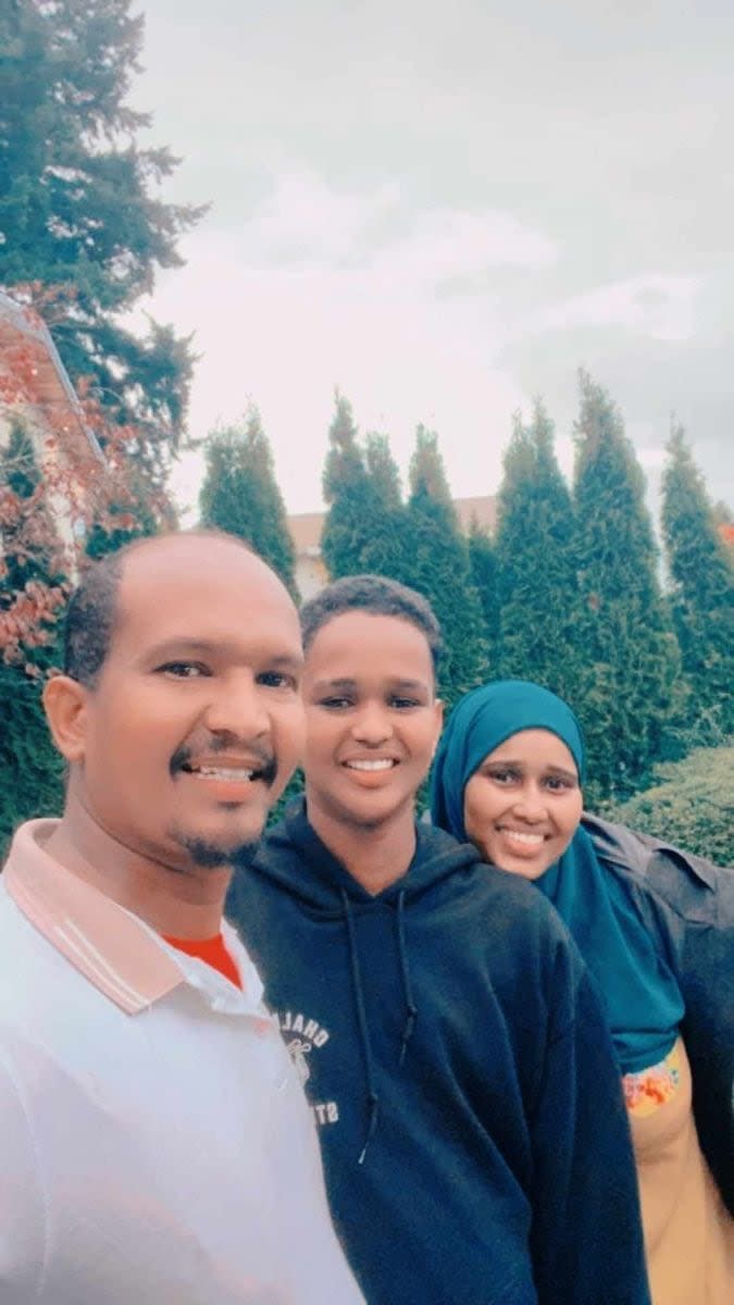 Farah Ali Mohamud (left) is pictured with his son and wife. The family says the truck driver lost contact with them shortly after arriving in Winnipeg on Friday.