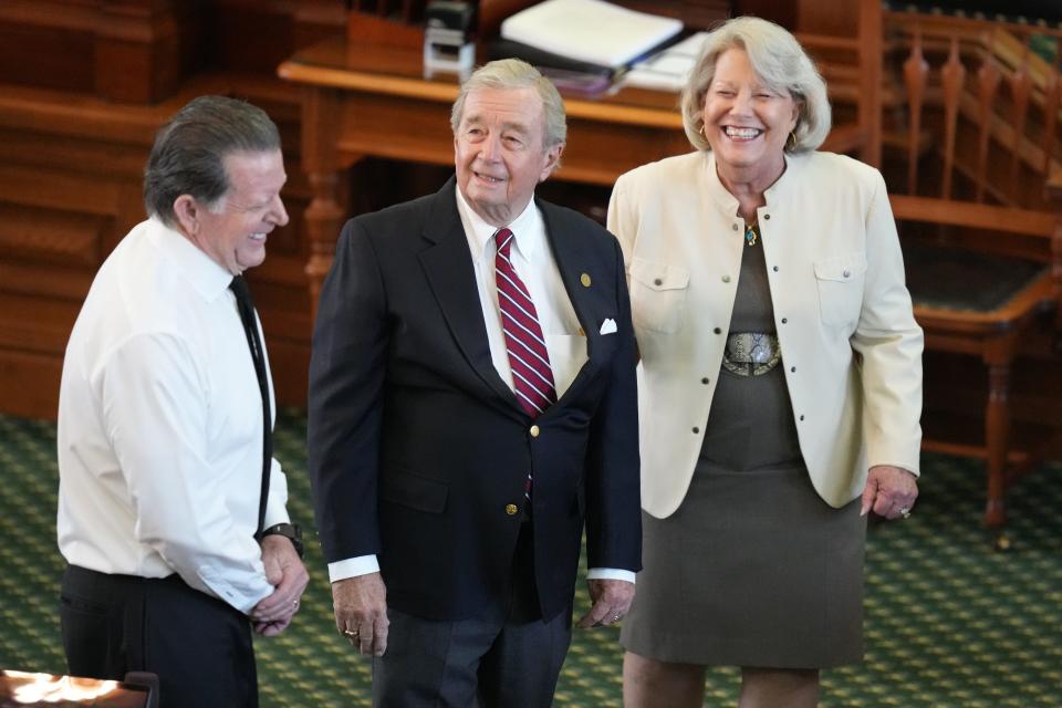 Prosecuting attorney Dick DeGuerin, center, speaks with Ken Paxton defense attorney Dan Cogdell and Secretary of the Senate Patsy Spaw on the Senate floor Tuesday.