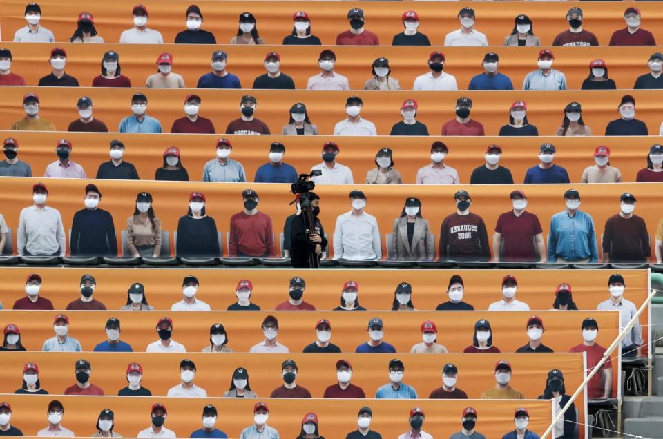 Stadium seats in Incheon, South Korea, are covered with pictures of fans before the start of a baseball game May 5.