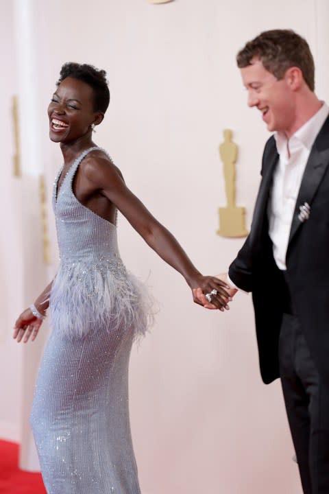 HOLLYWOOD, CALIFORNIA – MARCH 10: (L-R) Lupita Nyong’o and Joseph Quinn attend the 96th Annual Academy Awards on March 10, 2024 in Hollywood, California. (Photo by Mike Coppola/Getty Images)