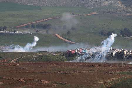 Smoke rises from shells fired from Israel over al-Wazzani area in southern Lebanon January 28, 2015. REUTERS/ Karamallah Daher