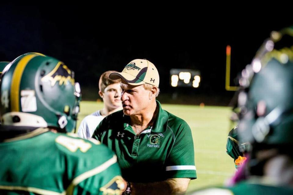 Head coach Ned Gonet of Ravenscroft talks with his players during a timeout in a football game played on Oct. 10 at Ravenscroft High School in Raleigh, N.C.