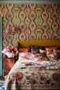 <p> Tiny bedroom ideas don&#x2019;t have to be bland, in fact creating layers of pattern and color can give a room a wonderful and enticing jewel box feel.&#xA0; </p> <p> &apos;Opt for patterns that create a trompe l&#x2019;oeil, such as the &#x2018;Hippie Paisley&#x2019; wallpaper design, with an undulating vertical motif filled with intense color and dazzling floral forms, this design draws the eye upwards making the space feel taller, whilst layering patterned cushions on the bed will work in the same way creating a focal point,&apos; says Stefan Ormenisan, creative director and founder of MindTheGap. </p>
