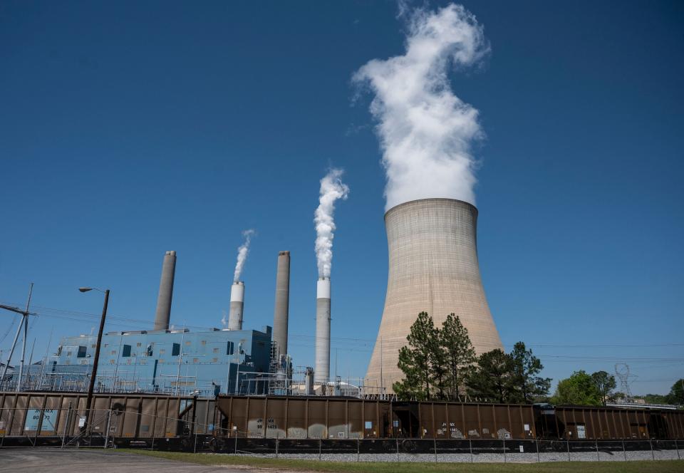 Steam rises from the Miller coal Power Plant in Adamsville, Alabama, on April 13. Power stations like this would likely need to shut down by the end of this decade to hit Biden's climate goals. (Photo: ANDREW CABALLERO-REYNOLDS via Getty Images)