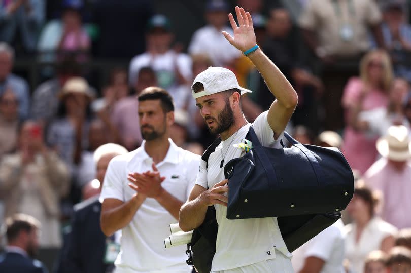 Jacob Fearnley of Edinburgh acknowledges the crowd as he leaves the court following defeat against Novak Djokovic