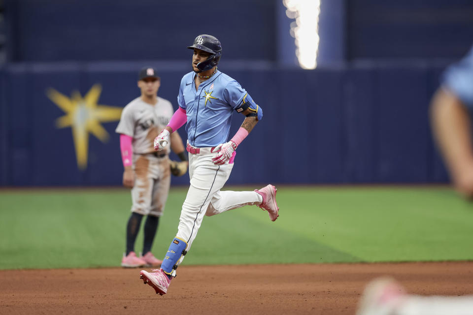 Tampa Bay Rays' Jose Siri rounds the bases after hitting a grand slam against the New York Yankees during the seventh inning of a baseball game Sunday, May 12, 2024, in St. Petersburg, Fla. (AP Photo/Mike Carlson)