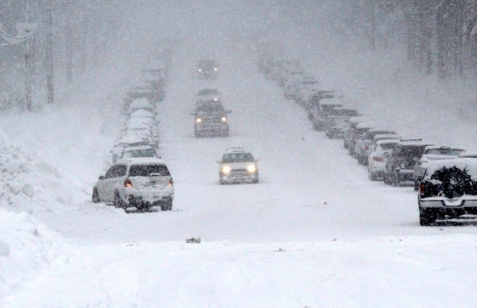 Drivers make their way up and down a snow-packed street in South Lake Tahoe, Calif., Friday, Feb. 15, 2019.  A winter storm will spread weather misery across the nation from Tuesday to Thursday this week.