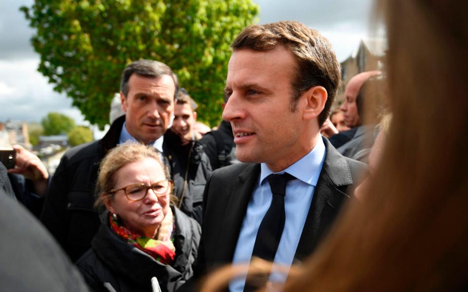 With less than a fortnight until the final vote, Macron was greeted with chants of "President Marine" - Credit: AFP PHOTO / POOL / Eric FEFERBERGERIC FEFERBERG/AFP/Getty Images