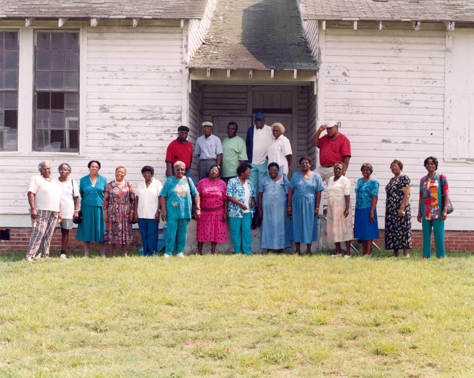 Members of the committee to save the Myrtle Beach Colored School stand outside the old school building before it was demolished.