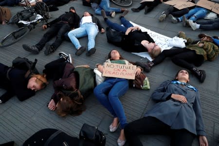 Activists stage a die-in as a part of the Global Climate Strike in Budapest