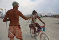 <p>Participants get misted by compressed air and water as approximately 70,000 people from all over the world gathered for the annual Burning Man arts and music festival in the Black Rock Desert of Nevada, Aug. 30, 2017. (Photo: Jim Urquhart/Reuters) </p>