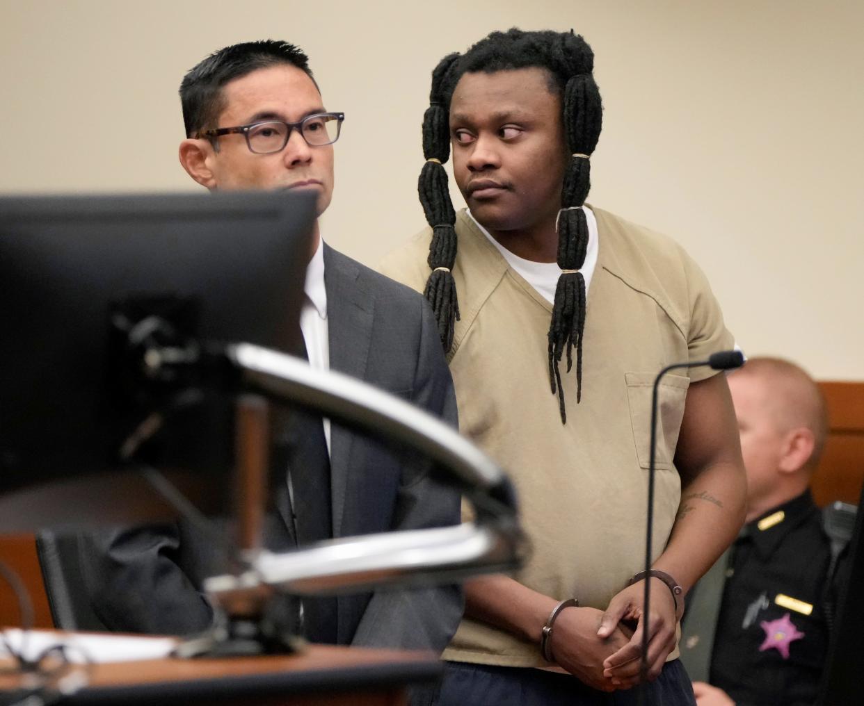 Ricky Williams Jr., right, a 34-year-old from Columbus' South Side, stands with his defense attorney, Nathan Akamine, left, on Tuesday in Franklin County Common Pleas Court, where Judge Kim Brown sentenced Williams to life in prison with the possibility of parole after 22 years as recommended in a plea agreement. Williams pleaded guilty on Oct. 18 to murder, attempted murder and felonious assault for firing at two vehicles in back-to-back road rage shootings in October 2020, killing Christina Perry in front of her 13-year-old son in one of the incidents. Williams apologized in court.