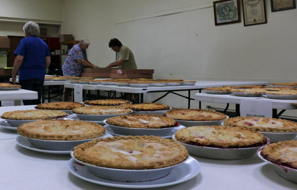 Ladies unbox a few donated pies in the Quimby Community Center.