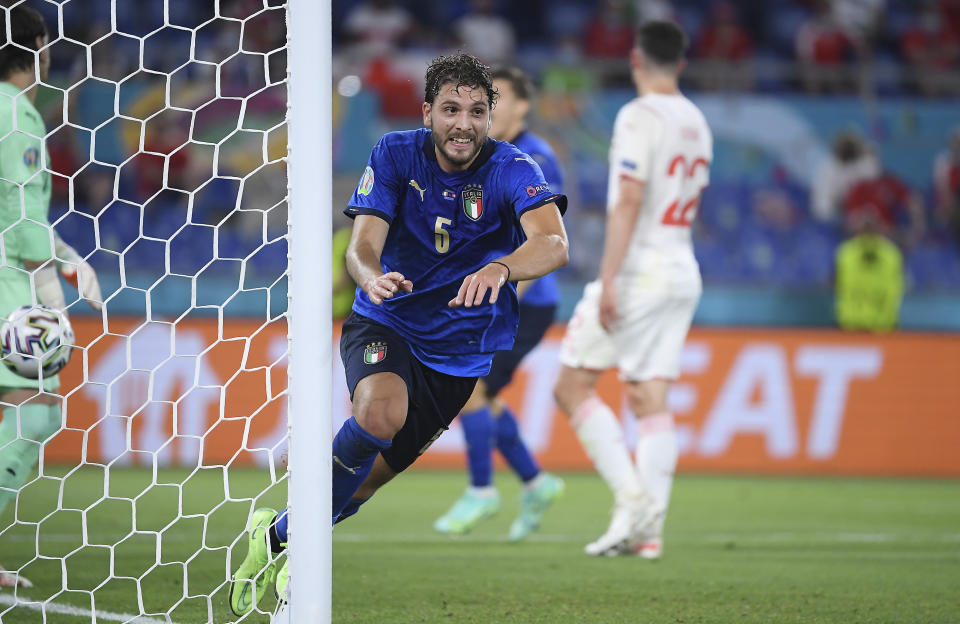Italy's Manuel Locatelli celebrates after scoring his side's opening goal during the Euro 2020 soccer championship group A match between Italy and Switzerland at Olympic stadium in Rome, Wednesday, June 16, 2021. (Ettore Ferrari, Pool via AP)
