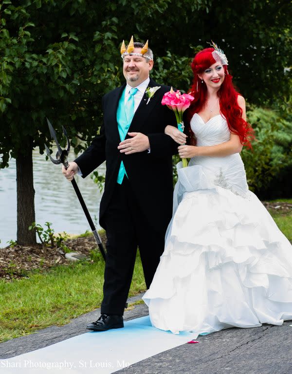 <div class="caption-credit"> Photo by: Shari Photography</div>Jamie's father walked his daughter down the aisle dressed as King Triton to an instrumental version of The Little's Mermaid's "Part of Your World."