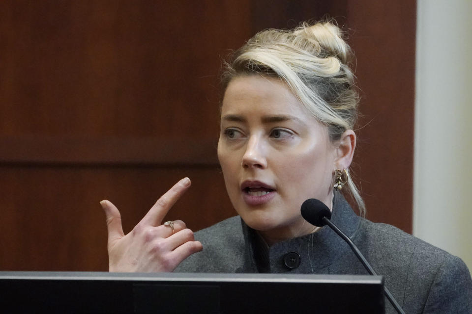 Actor Amber Heard testifies in the courtroom at the Fairfax County Circuit Courthouse in Fairfax, Va., Monday, May 16, 2022. Actor Johnny Depp sued his ex-wife Amber Heard for libel in Fairfax County Circuit Court after she wrote an op-ed piece in The Washington Post in 2018 referring to herself as a "public figure representing domestic abuse." (AP Photo/Steve Helber, Pool)