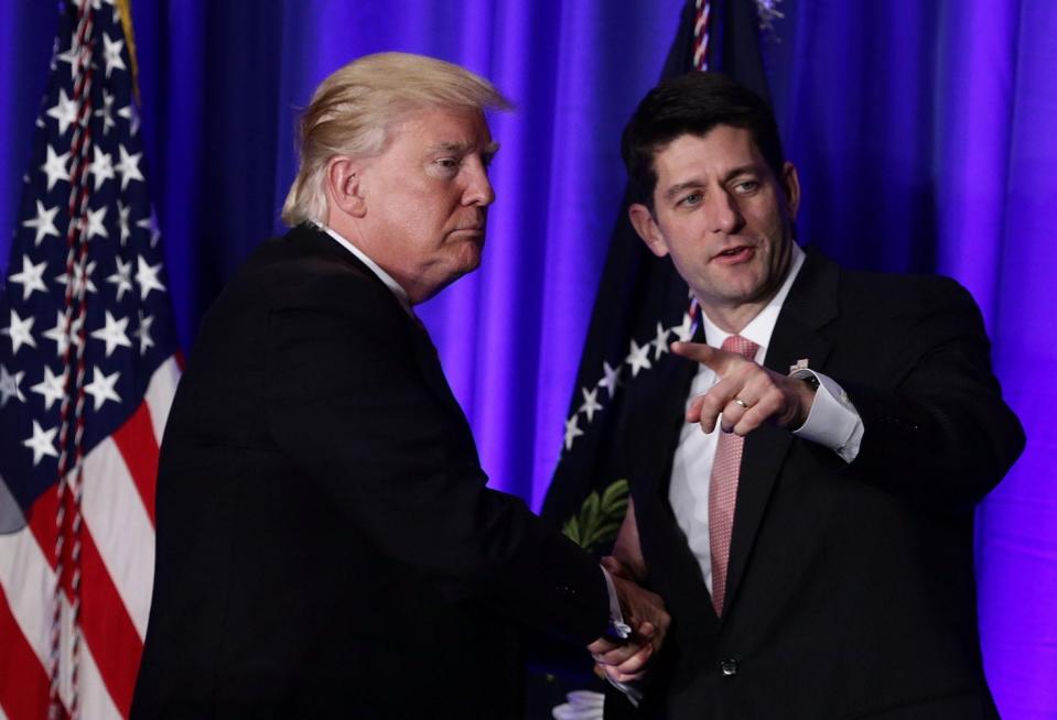 President Donald Trump shakes hands with Speaker of the House Rep. Paul Ryan (R-Wis.).