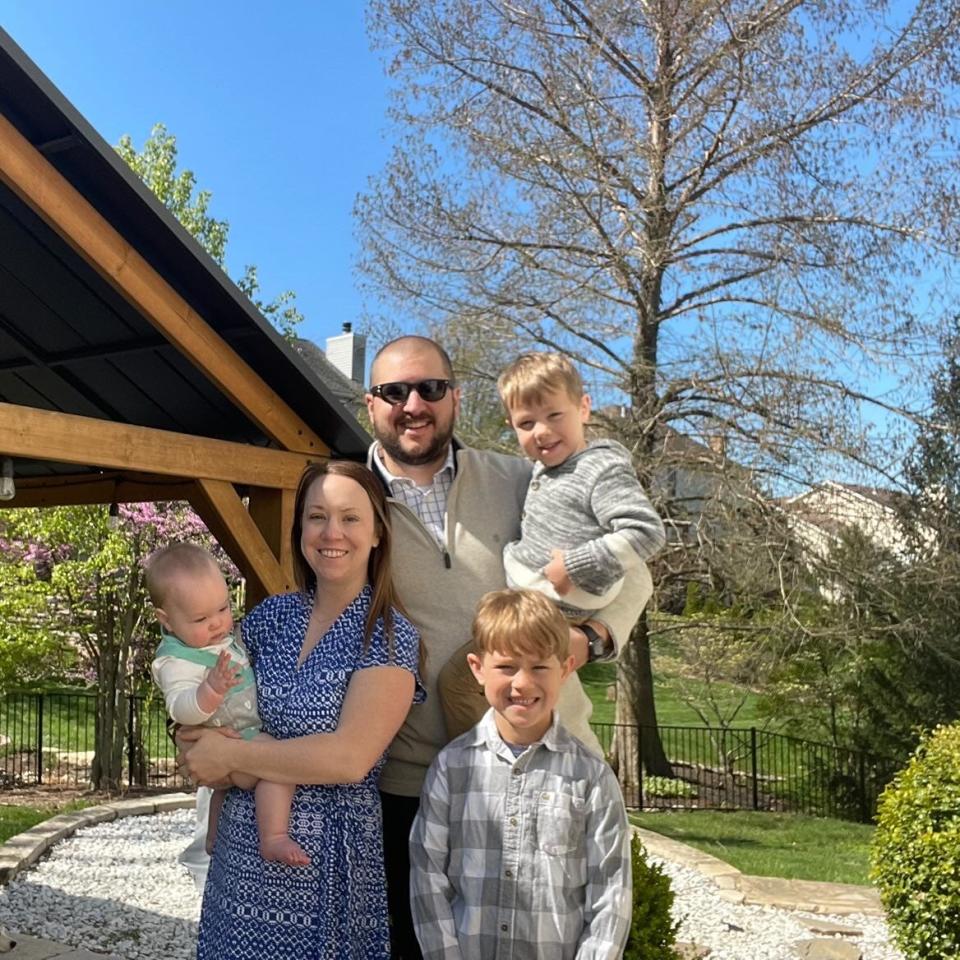 Crystal Rusch poses with her family, including the two sons she had via IVF.