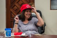 Miriam Sliter wears her "Keep America Great" hat as she watches US President Donald Trump acceptance speech for the Republican Party nomination for reelection during the final day of the Republican National Convention on TV in the office of San Diego County's Republican Party in Rancho Bernardo, California on August 27, 2020. - President Donald Trump tore into his election challenger Joe Biden as a threat to the "American Dream" in a bruising speech August 27 accepting the Republican nomination for a second term against a backdrop of racial tensions and the deadly coronavirus pandemic. (Photo by ARIANA DREHSLER / AFP) (Photo by ARIANA DREHSLER/AFP via Getty Images)