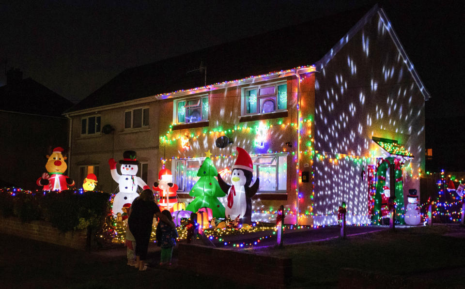 A mum has gone all out to cheer up her kids and neighbours by putting up her CHRISTMAS decorations three months early - including 3,000 outdoor lights. Caroline Gabe, 46, has been shielding with her children since March - and said putting up her tree and decorations in September was a much-needed boost. She has spent the year buying outdoor lights and installations - from as far away as America - and put them all up last week, on a whim. Almost all of them are outside - including 3,000 fairy lights, sparkling snow, an 8ft inflatable snowman, as well as Santa and his reindeer.