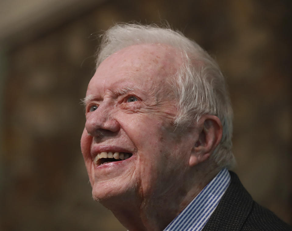 FILE - In this June 9, 2019 file photo, former President Jimmy Carter smiles as he returns to Maranatha Baptist Church to teach Sunday School, less than a month after falling and breaking his hip, in Plains Ga. The 94-year-old former U.S. president said Friday, June 28, that he believes Russia’s meddling “if fully investigated would show that Trump didn't actually win the election in 2016.” Carter said he believes Trump “lost the election” and became president “because the Russians interfered on his behalf." (Curtis Compton/Atlanta Journal-Constitution via AP, File)