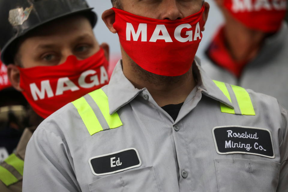 People wearing MAGA masks attend then-President Donald Trump's campaign event in Martinsburg, Pa, in October 2020.