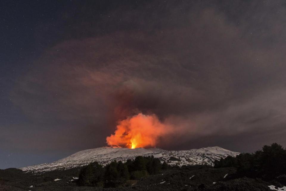 Snow-covered Mount Etna, Europe's most active volcano, has been spewing lava in recent days. (AP)