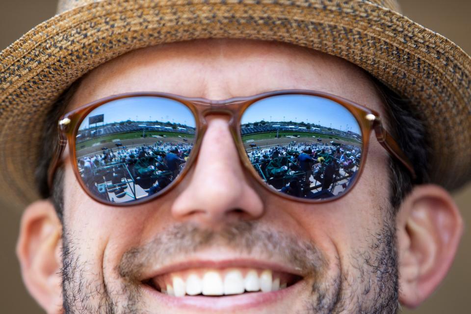 Justin Funk wears reflectiv sunglasses showing the crowd on the day of the 147th Kentucky Derby at Churchill Downs. May 1, 2021