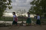 Myanmar children make their way to school in Dala on November 11, 2015