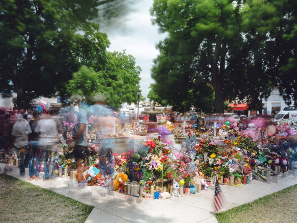 Mourners visit the memorial to the victims of the Uvalde school shooting at the town square in Uvalde, Texas, on May 30. In all, 21 people, 19 students and two teachers, were killed by a gunman at Robb Elementary School on May 24.<span class="copyright">Christopher Lee—The New York Times/Redux</span>