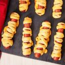 <p>Buttery, flaky, cheesy, and just a little spooky - you really can't go wrong.</p><p>Get the recipe from <a href="https://www.delish.com/holiday-recipes/halloween/a28621353/mummy-hot-dogs-recipe/" rel="nofollow noopener" target="_blank" data-ylk="slk:Delish;elm:context_link;itc:0;sec:content-canvas" class="link ">Delish</a>.</p>