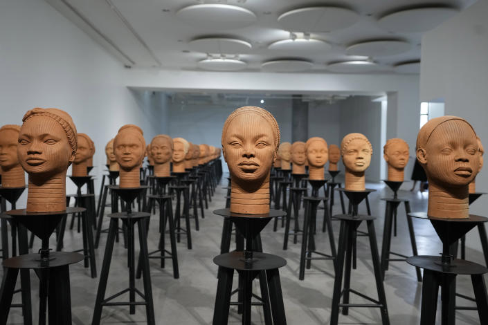 Sculptures created by French artist Prune Nourry, Inspired by ancient Nigerian Ife terracotta heads, titled "Statues Also Breathe," and representing the remaining 108 Chibok still in captivity are displayed in Lagos, Nigeria, Tuesday , Dec. 13, 2022. On April 14, 2014, Boko Haram stormed the Government Girls Secondary School in the Chibok community in Borno state and forcefully took the girls as they prepared for science exams, sparking the #BringBackOurGirls social media campaign that involved celebrities worldwide including former U.S. First Lady Michelle Obama. (AP Photo/Sunday Alamba)