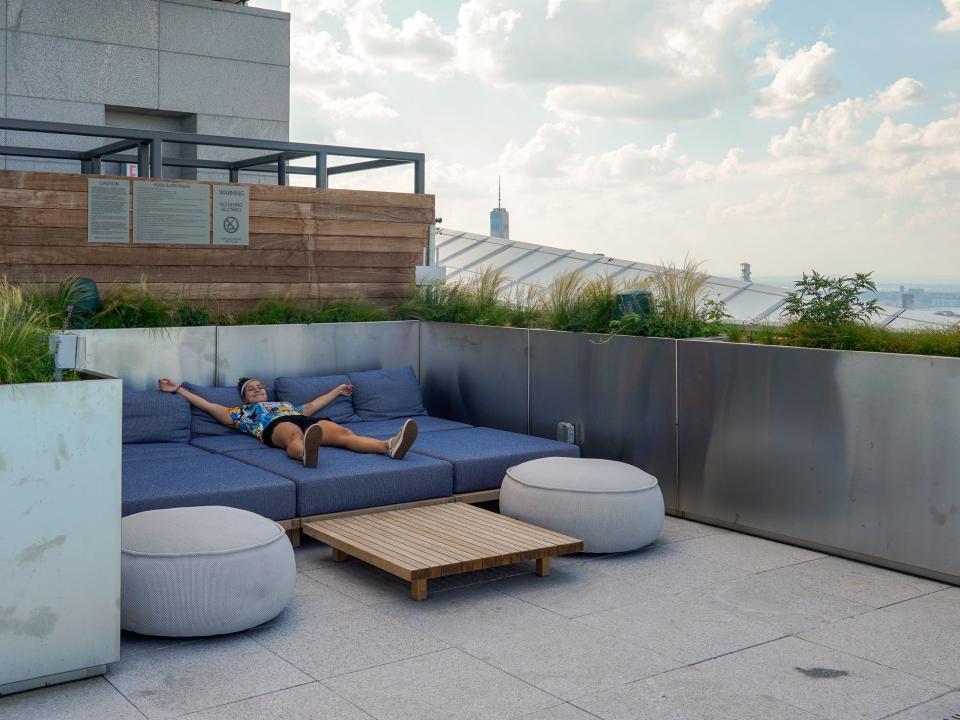 The author laying on an outdoor couch