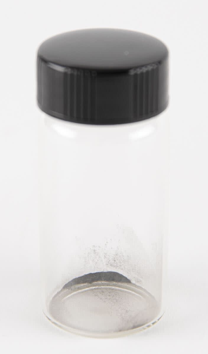 This April 2022 handout photograph provided by RR Auction shows moon dust in a vial from the 1969 Apollo 11 mission, which was pulled from an auction listing after NASA said the dust, and some cockroaches that were fed the dust, are property of the federal government. (Nikki Brickett/RR Auction photo via AP)