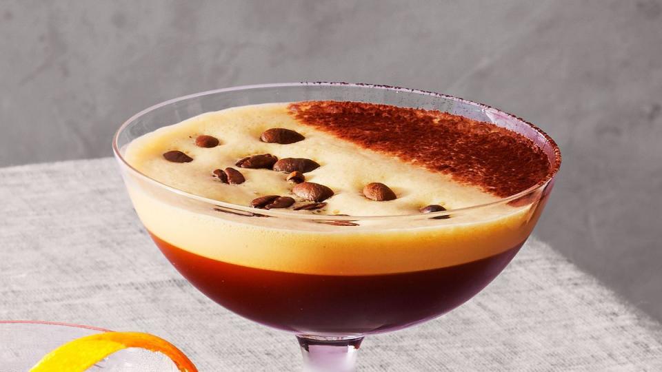 espresso martini with coffee beans floating on top