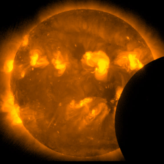 This image, taken by the sun-watching Hinode satellite, was taken two minutes after the start of the annular solar eclipse on May 20, 2012.