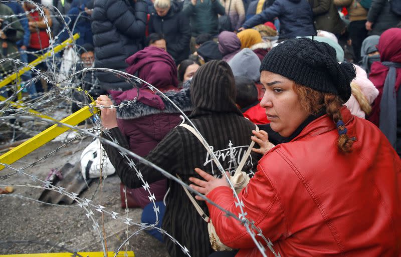 A migrant looks on as they gather at Turkey's Pazarkule border crossing with Greece's Kastanies, in Edirne