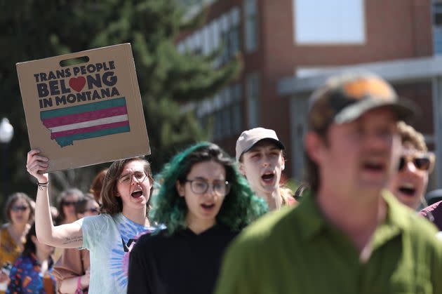 Transgender rights activists march through the University of Montana campus in Missoula, Montana, on May 3.  Dozens protested the censure of transgender Montana state Rep. Zooey Zephyr (D), who was barred from speaking after she said state lawmakers would have 