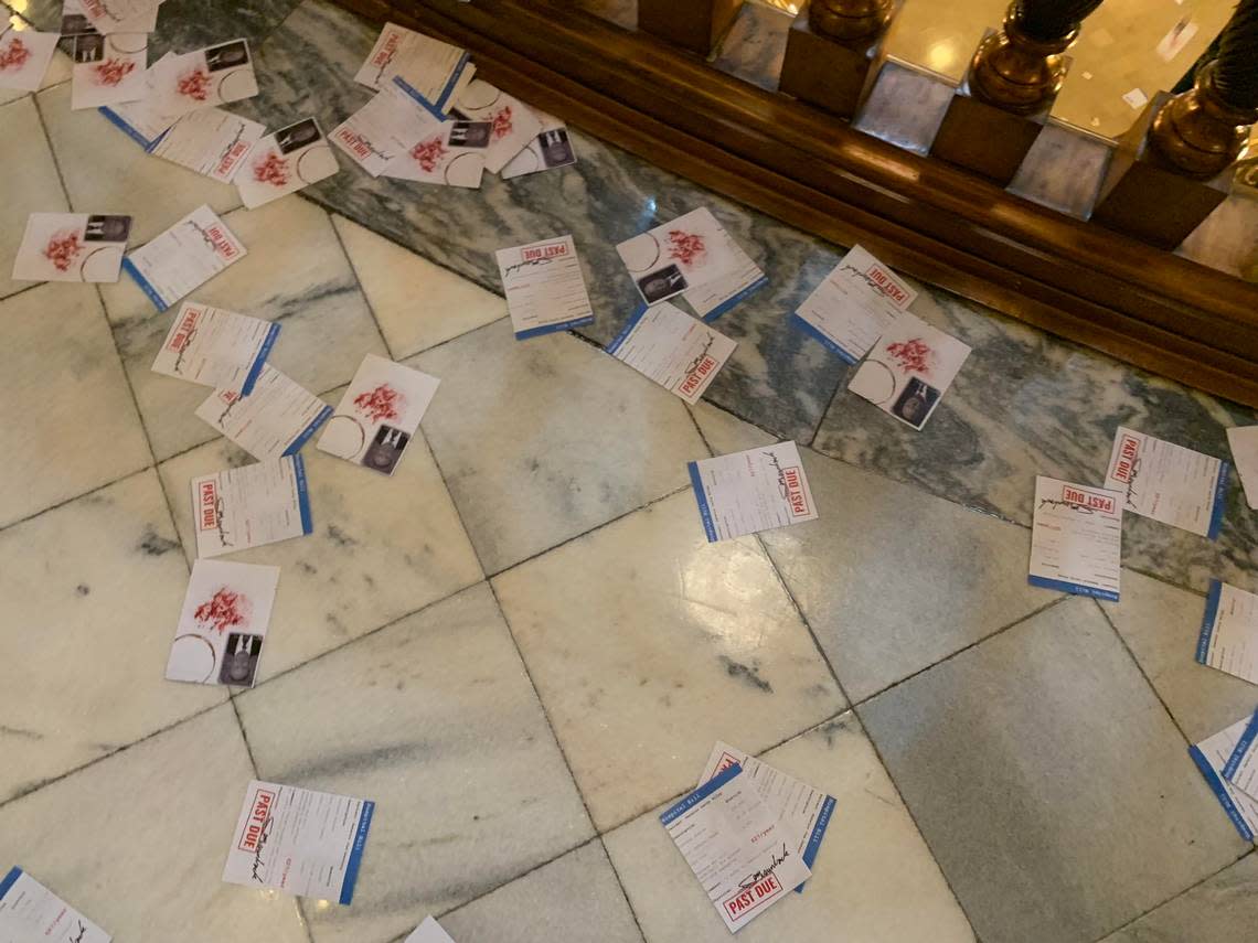 Several thousand leaflets mimicking hospital bills were dropped from the fifth-floor rotunda at the Kansas Statehouse in 2019 as part of a protest for Medicaid expansion