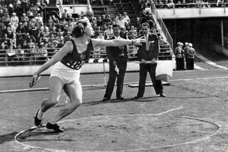 FILE - In this July 1952, file photo, Nina Romashkova, who won the first gold medal for the Soviets in the women's discus competition, winds up to throw during the Summer Olympics in Helsinki, Finland(AP Photo/File)