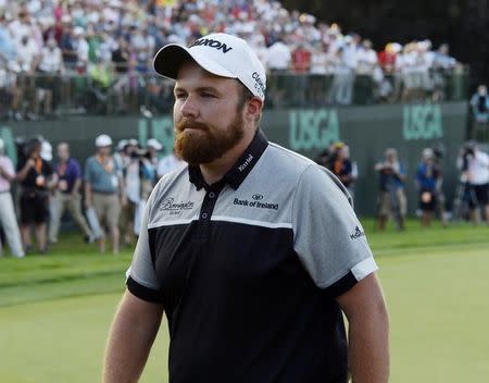 Jun 19, 2016; Oakmont, PA, USA; Shane Lowry walks off the 18th green after the final round of the U.S. Open golf tournament at Oakmont Country Club. Mandatory Credit: Michael Madrid-USA TODAY Sports