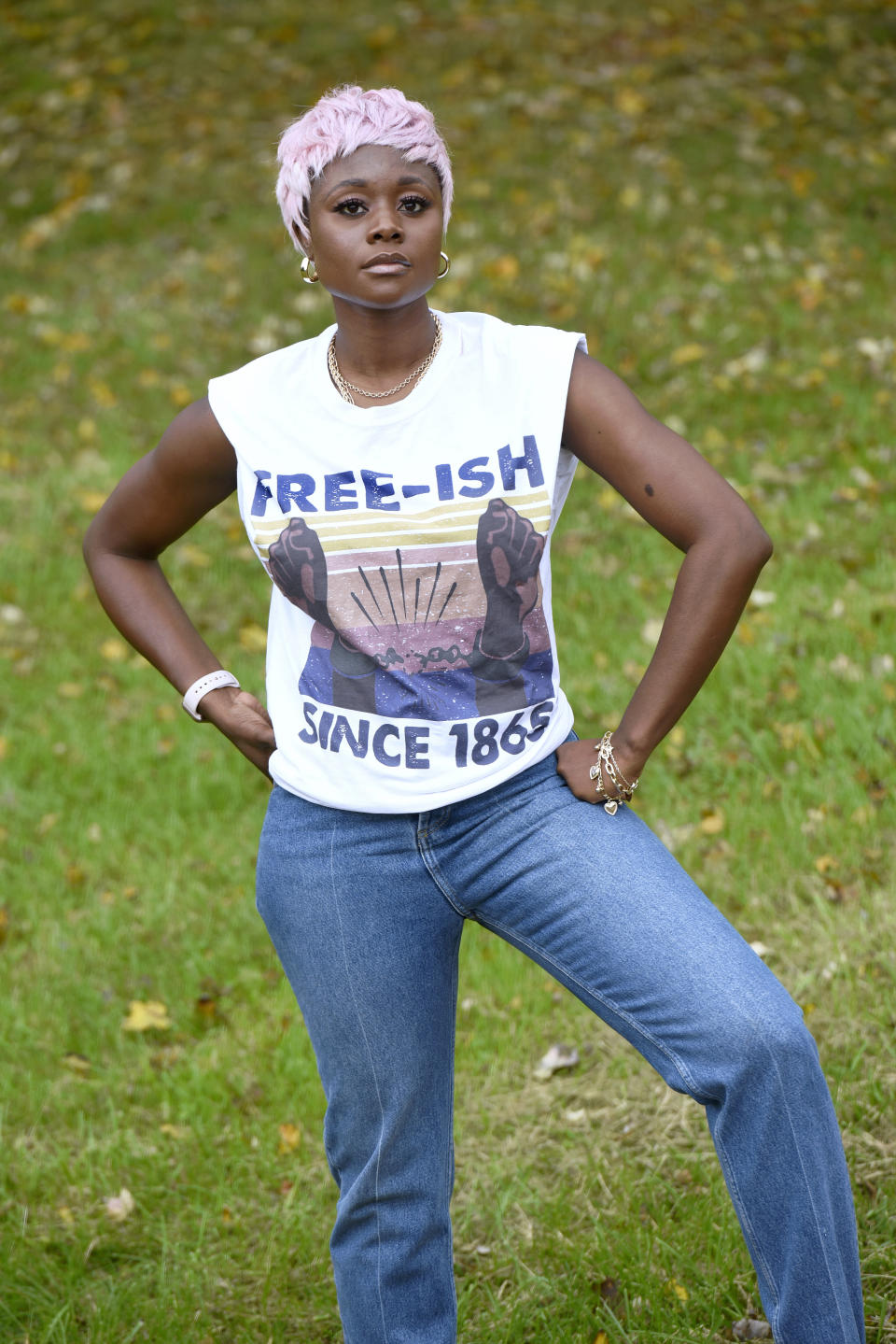 Nigerian American lifestyle blogger Nifesimi Akingbe stands outside her home in Randallstown, Md., near Baltimore, on Sunday, Oct. 11, 2020. Akingbe has been outspoken about racial equity since the police killing of George Floyd in Minneapolis. But amid the camaraderie younger Black immigrants like her feel with African Americans, they also see a generational divide in their communities. (AP Photo/Steve Ruark) (AP Photo/Steve Ruark)