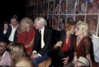 <p>Warhol returns to Studio 54—this time with actress Lorna Luft and singer Debbie Harry. They were attending a party for Interview, the magazine Warhol founded in 1969. </p>