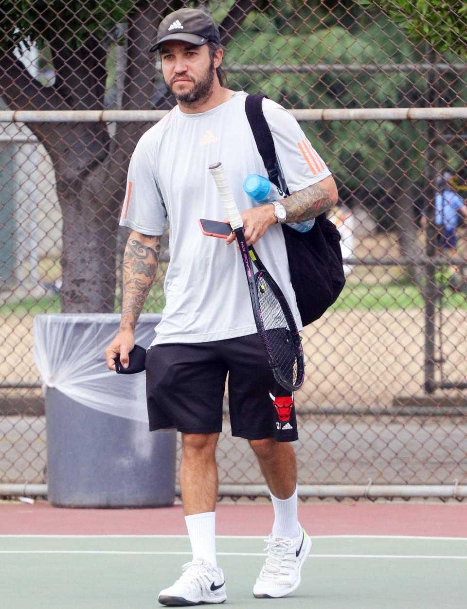 <p>Pete Wentz works up a sweat while playing tennis on Monday in L.A. </p>