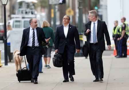 Federal prosecutors Jared Fishman, Rose Gibson and Nathan Williams, arrive outside the Charleston federal court building during the sentencing hearing for former North Charleston policeman Michael Slager in Charleston, South Carolina, U.S., December 6, 2017. REUTERS/Randall Hill