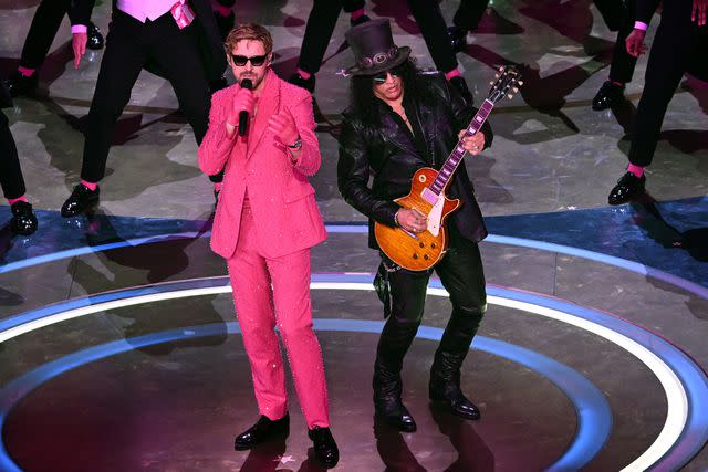 <p>PATRICK T. FALLON/AFP via Getty </p> Ryan Gosling and Slash performing 'I'm Just Ken' at the Oscars on March 10, 2024