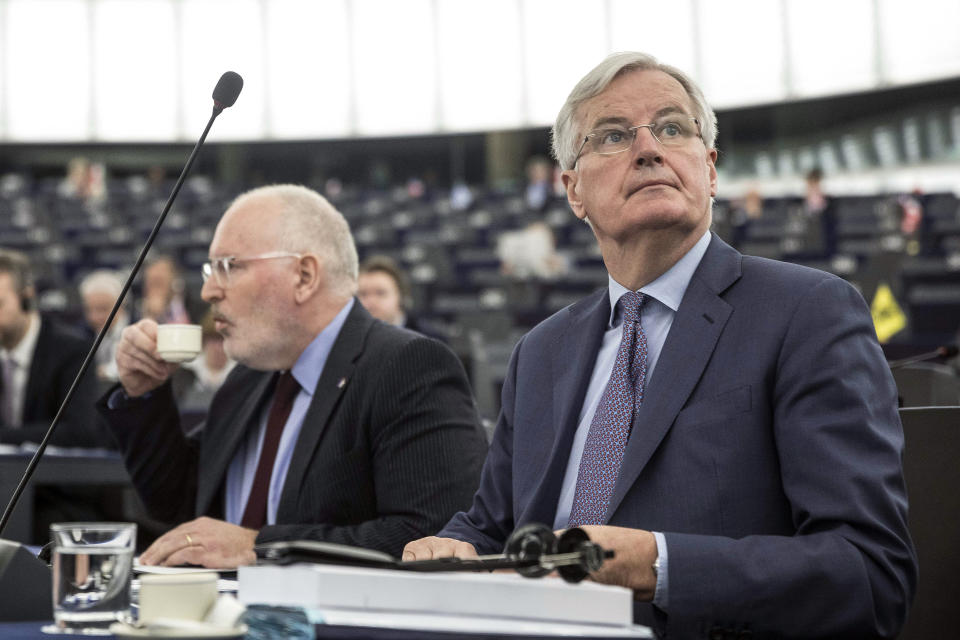 European Union's Frans Timmermans, first vice president of the Commission, left, and European Union's chief Brexit negotiator Michel Barnier attend a session at the European Parliament in Strasbourg, eastern France, Wednesday, March 13, 2019. British lawmakers rejected May's Brexit deal in a 391-242 vote on Tuesday night. Parliament will vote Wednesday on whether to leave the EU without a deal. (AP Photo/Jean Francois Badias)