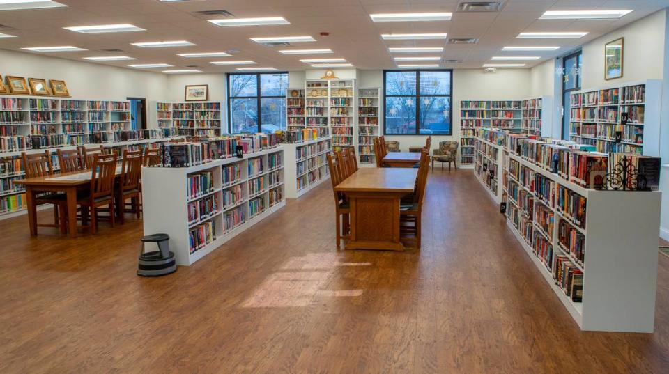 After photo of the main collection with new flooring, painted shelving and repaired walls at the Louis Latzer Public Library in Highland.