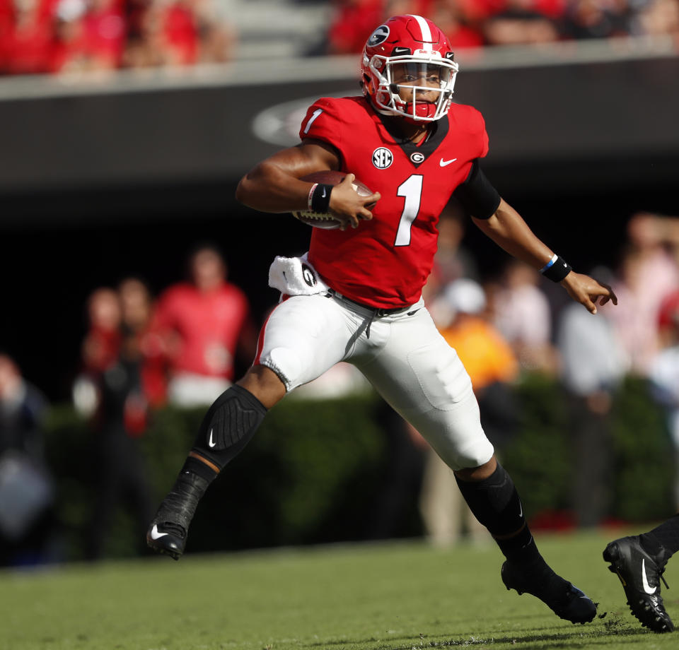 Georgia quarterback Justin Fields (1) looks for running room during the first half of an NCAA college football game against Tennessee Saturday, Sept. 29, 2018, in Athens, Ga. Georgia won 38-12. (AP Photo/John Bazemore)